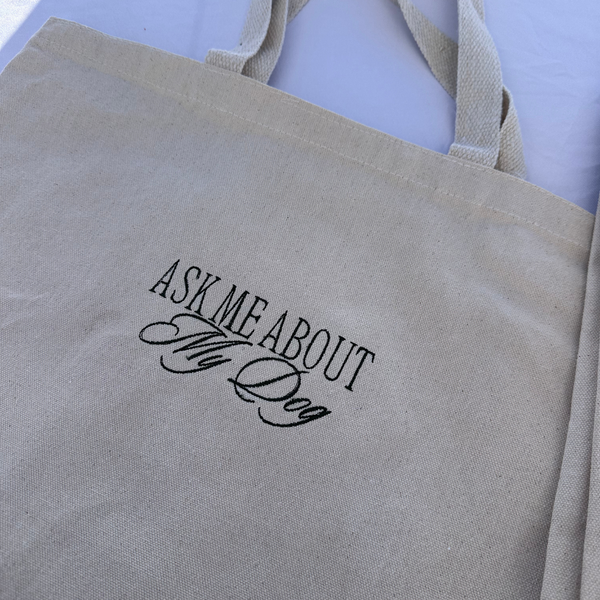Ask me about my dog embroidered tote bag